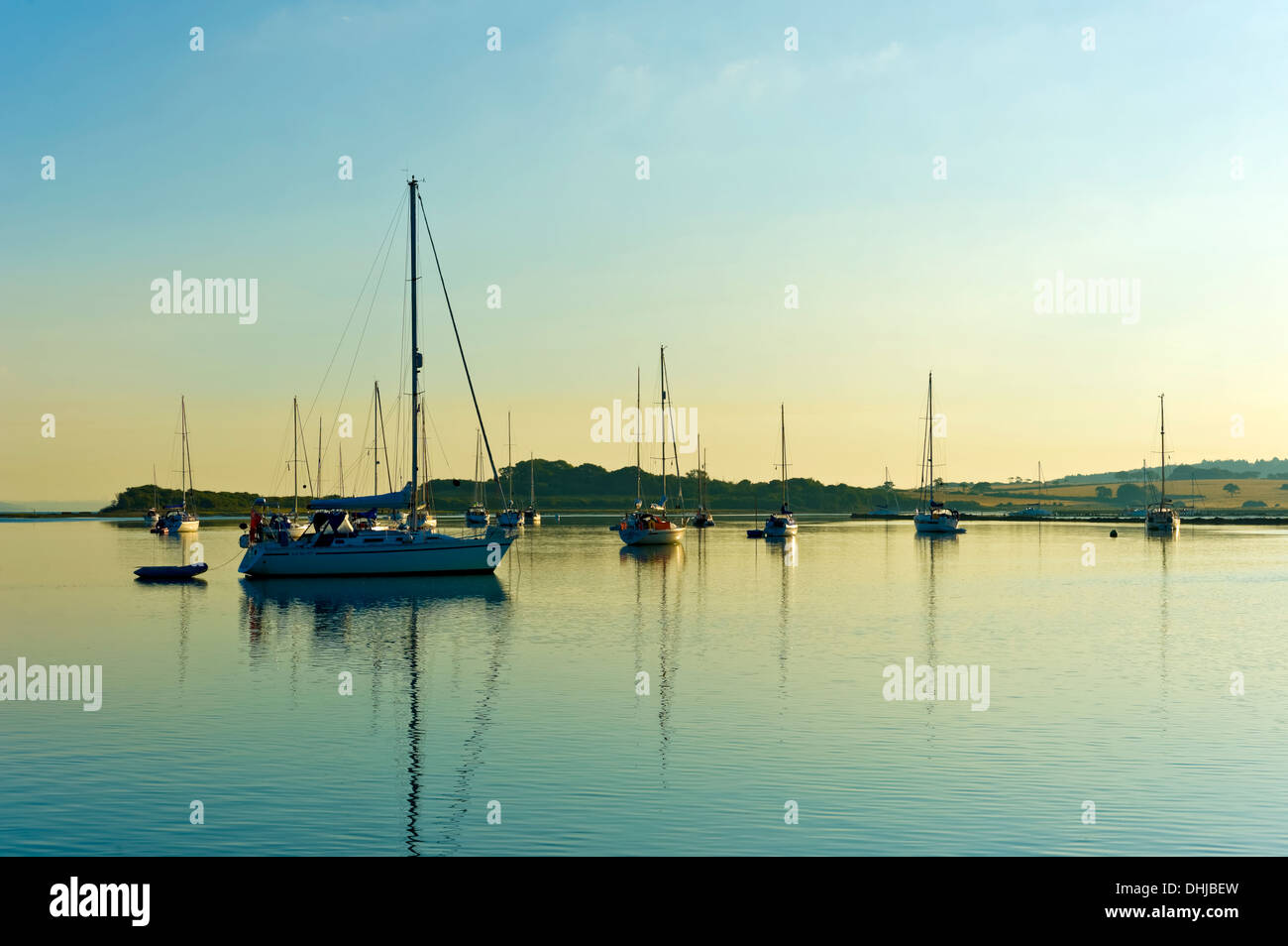 Yachts anchored in Newtown Creek at dawn, Isle of Wight, Hampshire, England UK. Stock Photo