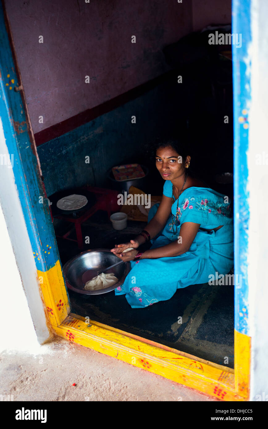 Indian woman making chapati in her home in a rural village. Andhra Pradesh, India Stock Photo