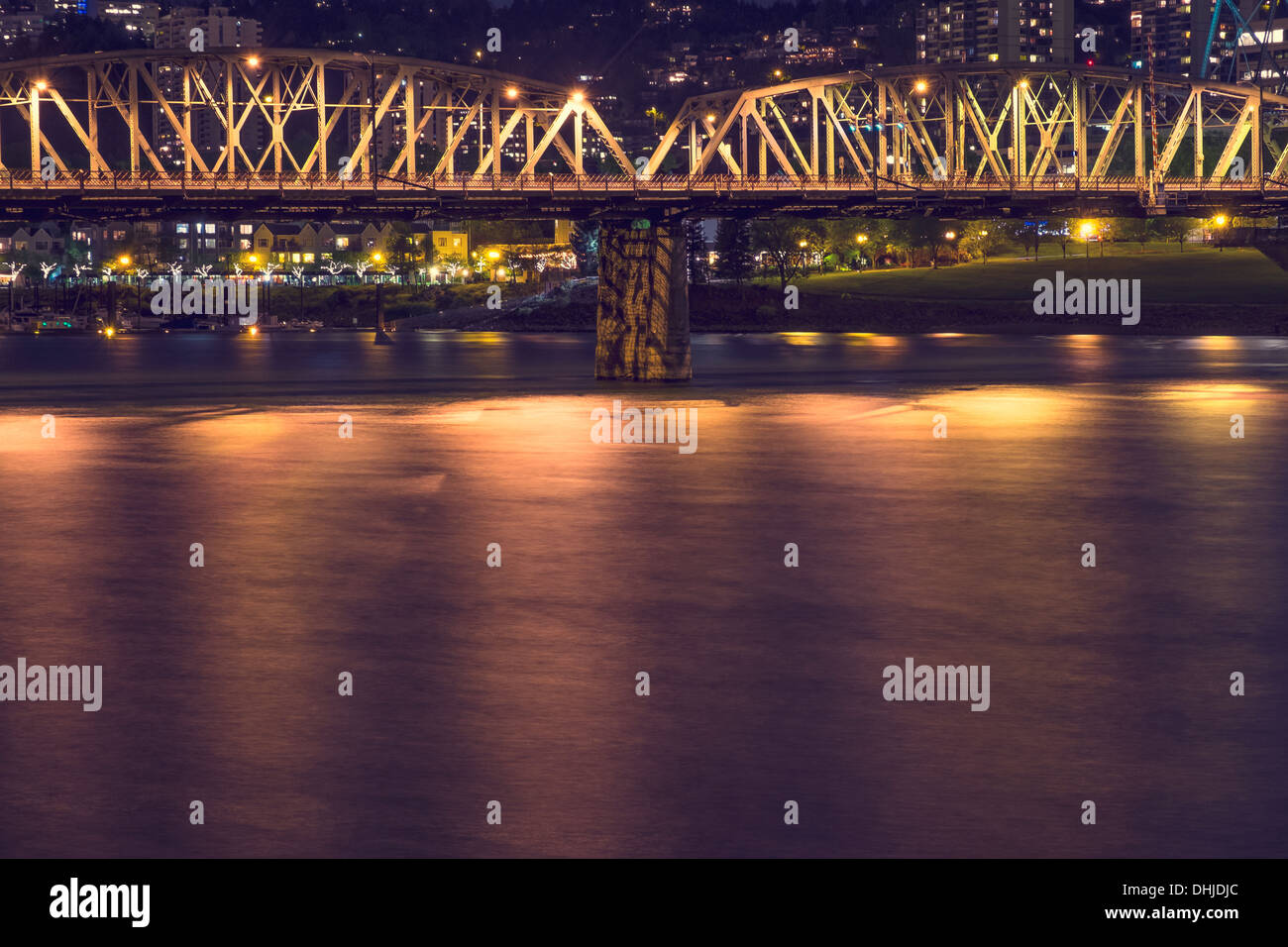 Hawthorne Bridge crosses over the Willamette River at night, Portland, Oregon Stock Photo