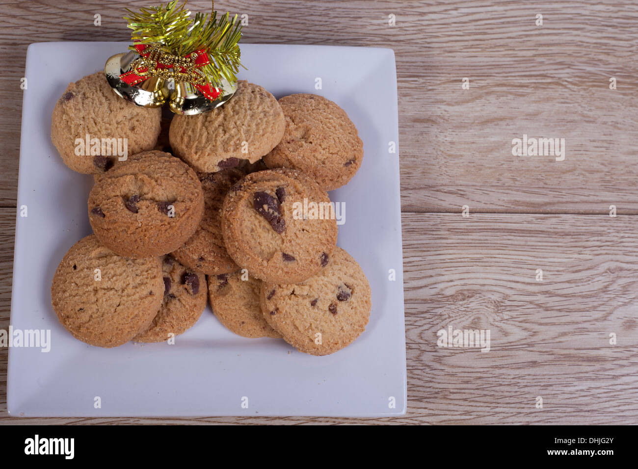 Plate of chocolate chip cookies with christmas decorations Stock Photo