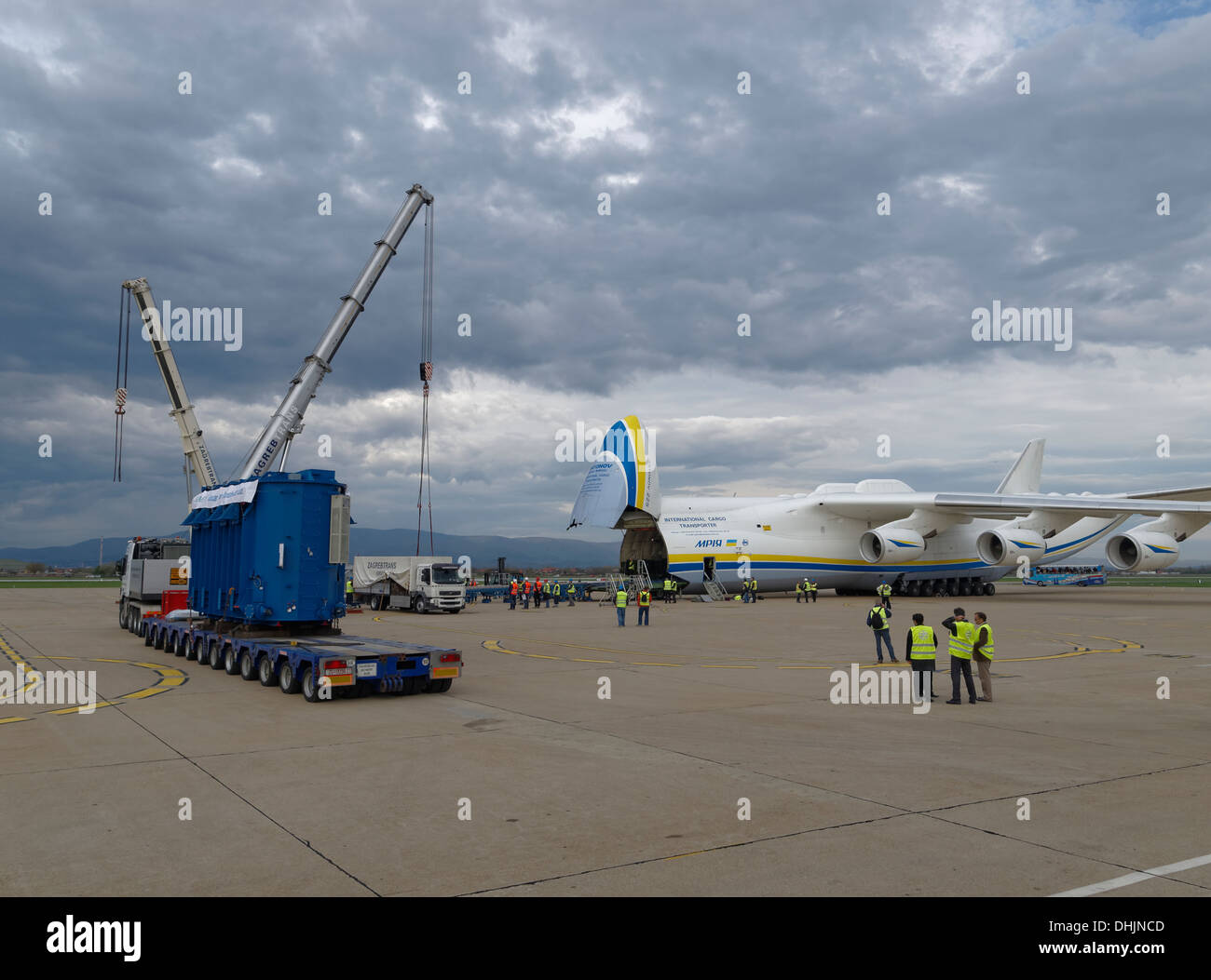 140 ton Koncar generator (blue box) prior loading into the Antonov An-225 Mriya heav-cargo airplane. Stock Photo