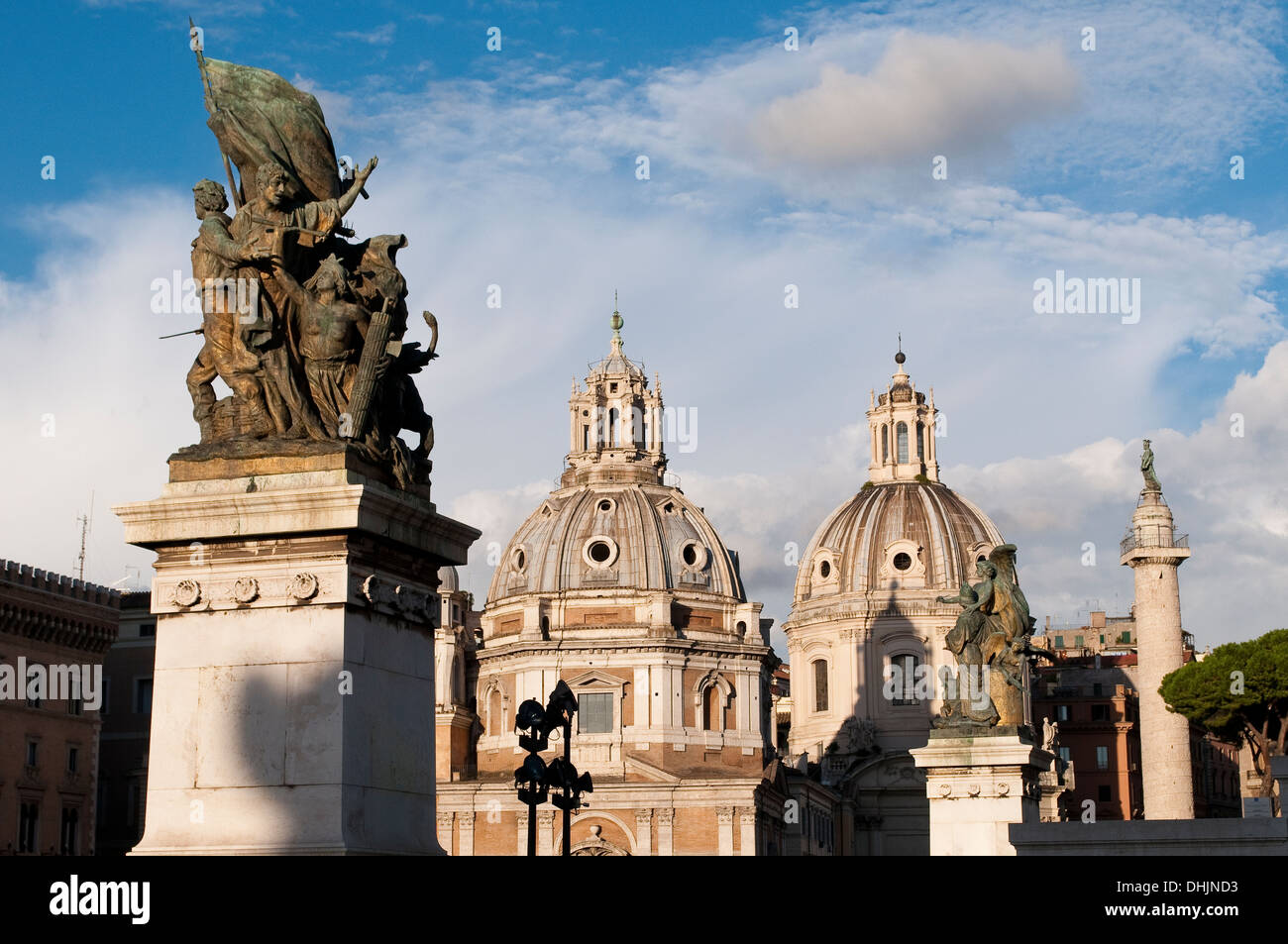 Two domes of  churches, Trajan's Column and statues of the Vittorio Emanuele II Monument, Rome, Italy Stock Photo