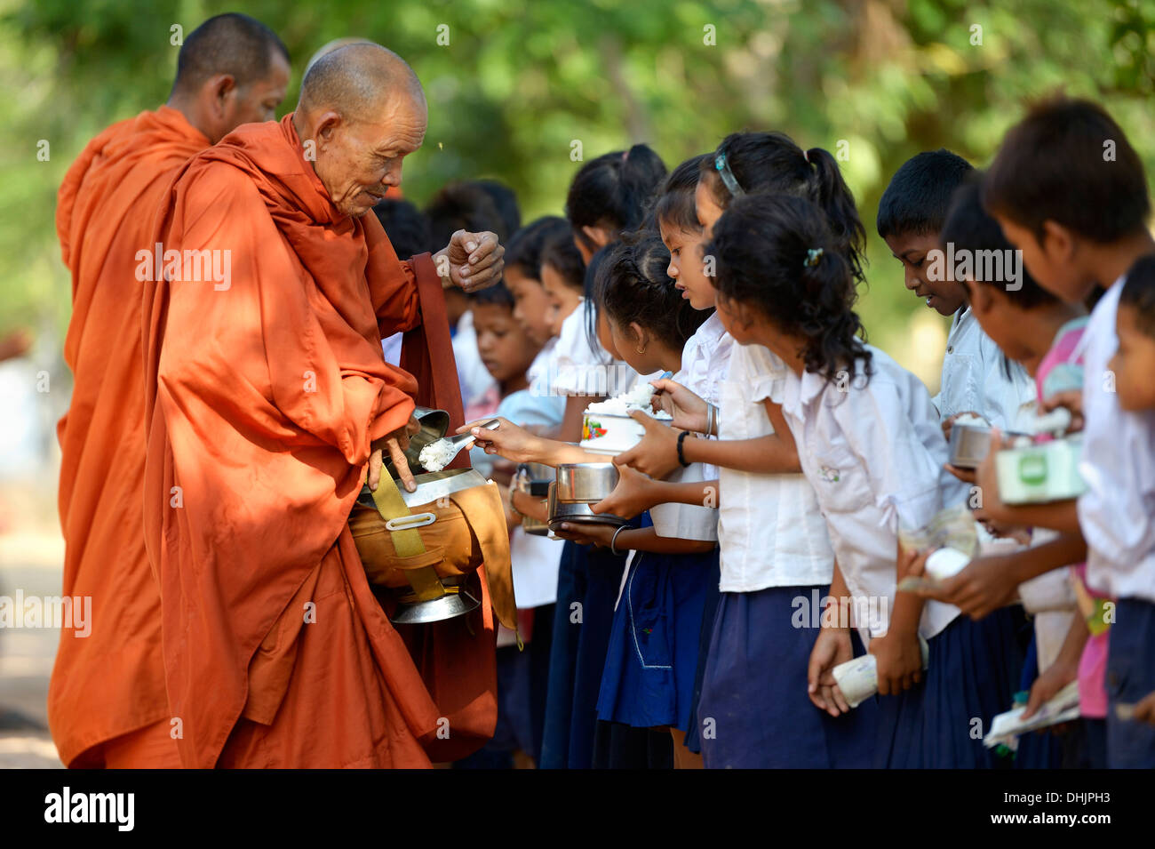 Cambodia, Takeo Province, Lompong, Cildren donating to Buddhistic monks during New Year's festival Stock Photo