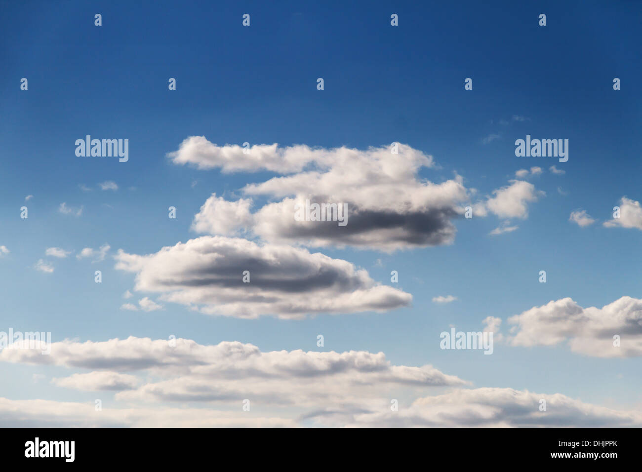 blue sky with white floating clouds Stock Photo - Alamy