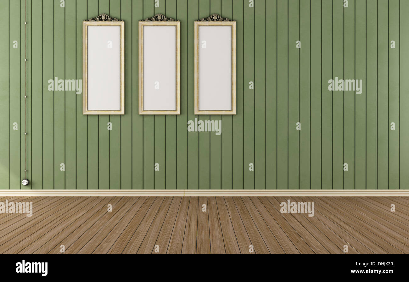 Vintage room with green wall paneling and empty frames - render Stock Photo