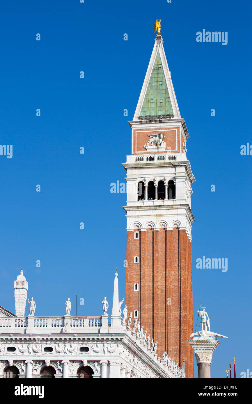 Statues of Libreria Nazionale Marciana and Campanile tower on Piazza San Marco, Venice, Veneto, Italy, Europe Stock Photo