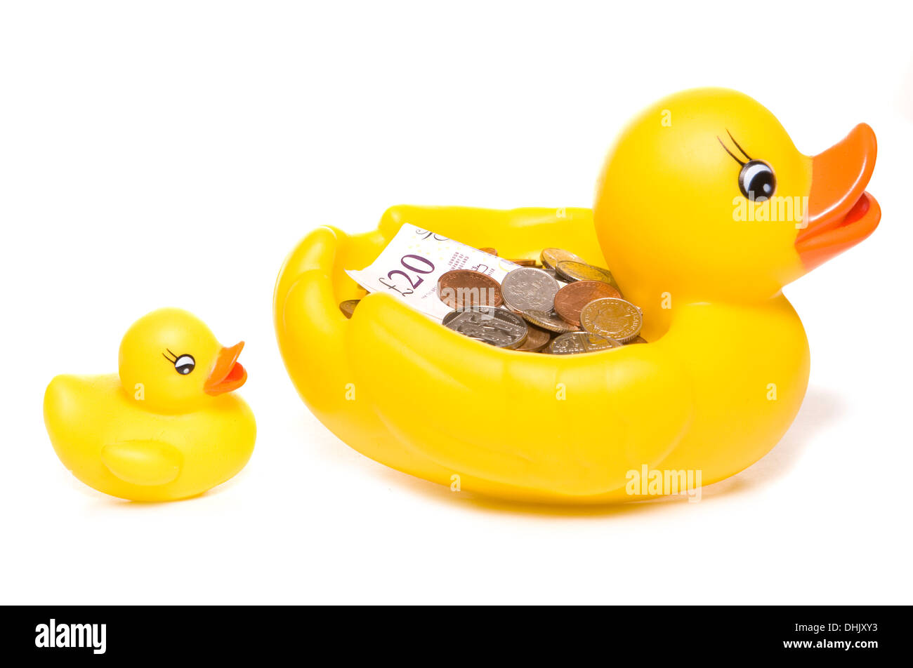 Rubber duck with money studio cutout Stock Photo