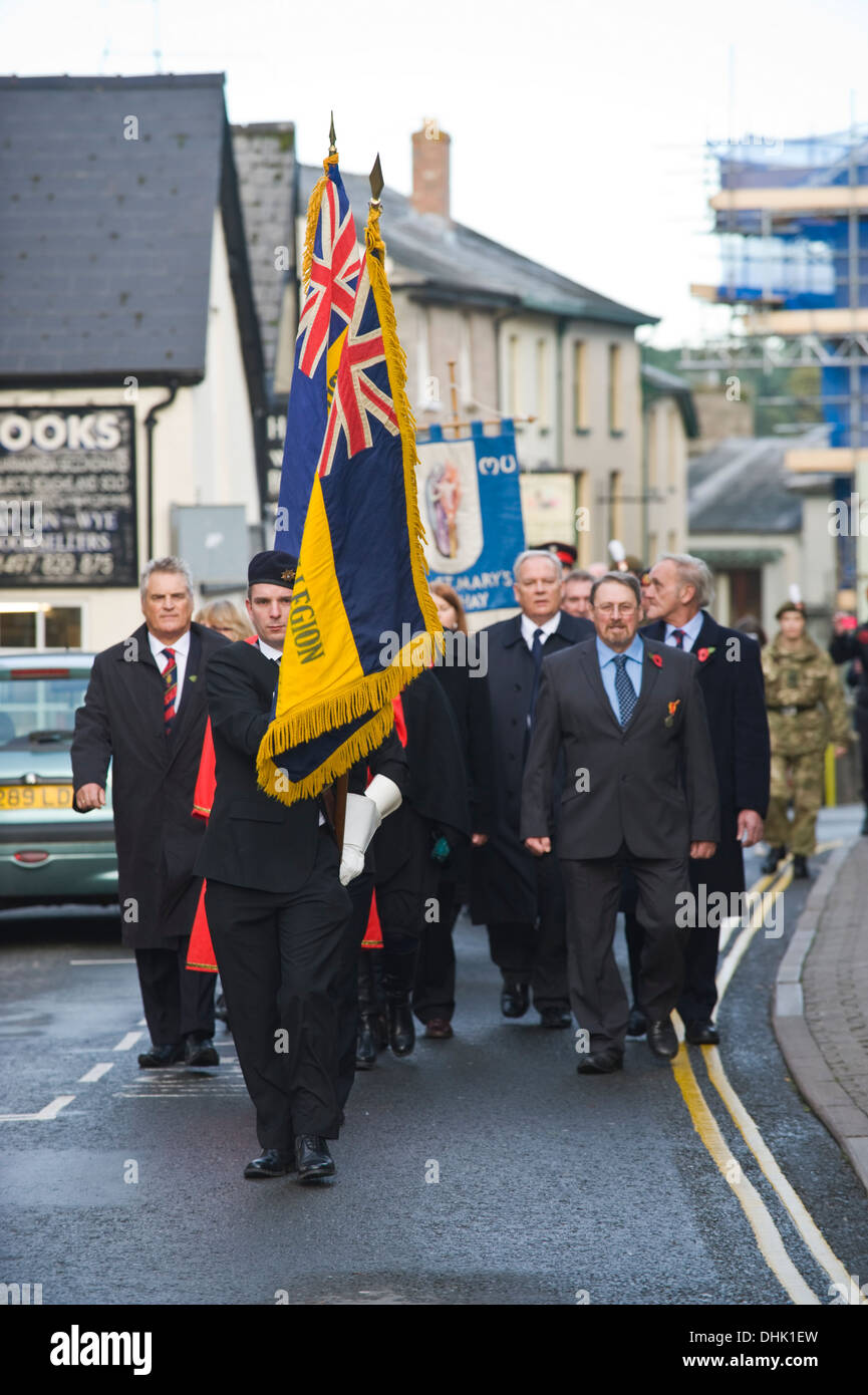 Remembrance Sunday parade with British Legion flags in front at Hayon