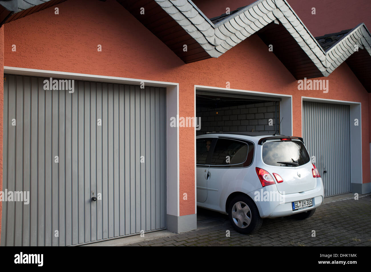 Renault Twingo reversing out of garage Stock Photo