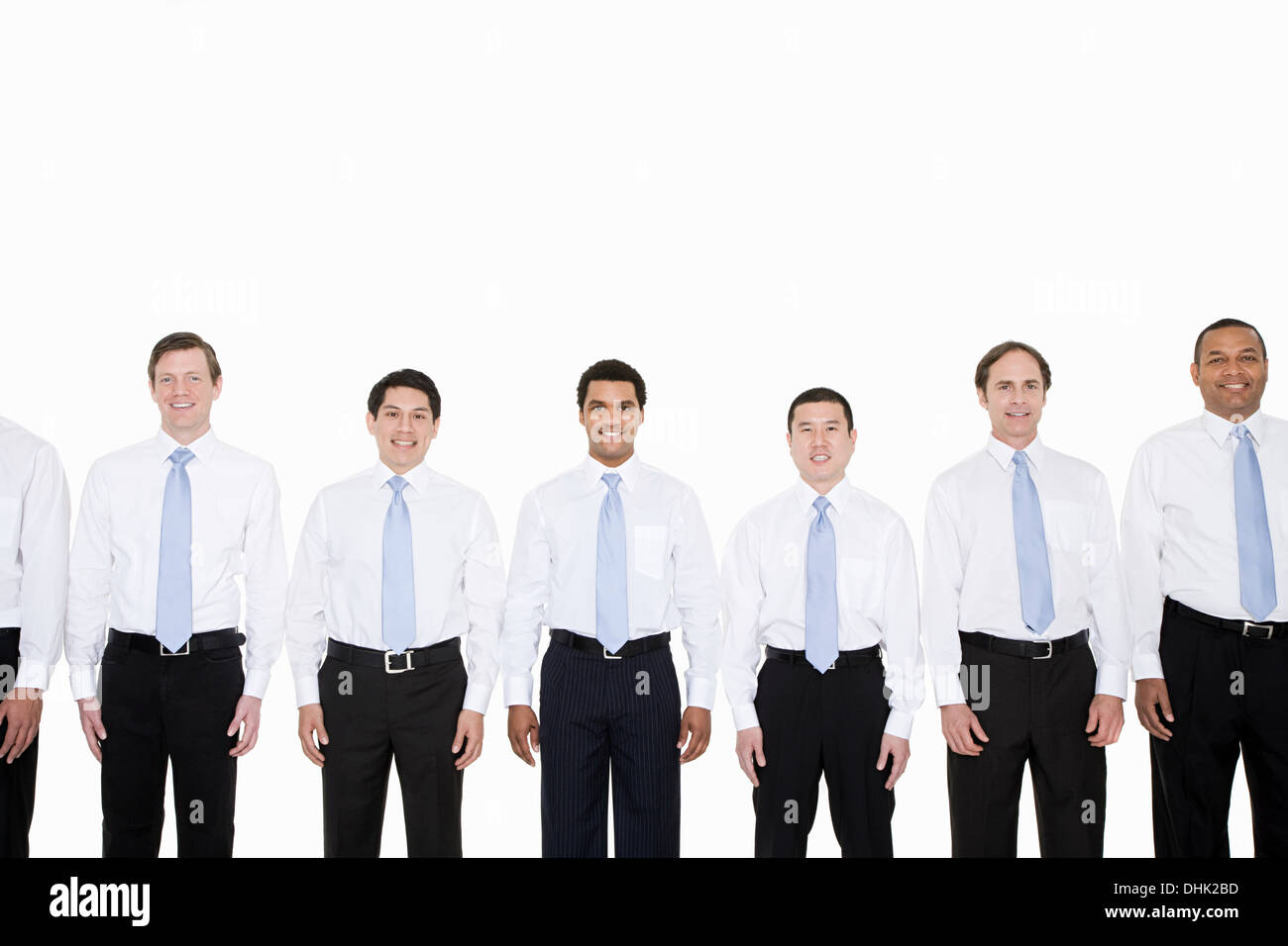 Similar looking businessmen in a row Stock Photo