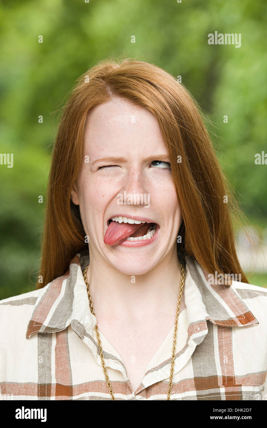Ginger haired girl making faces Stock Photo Alamy