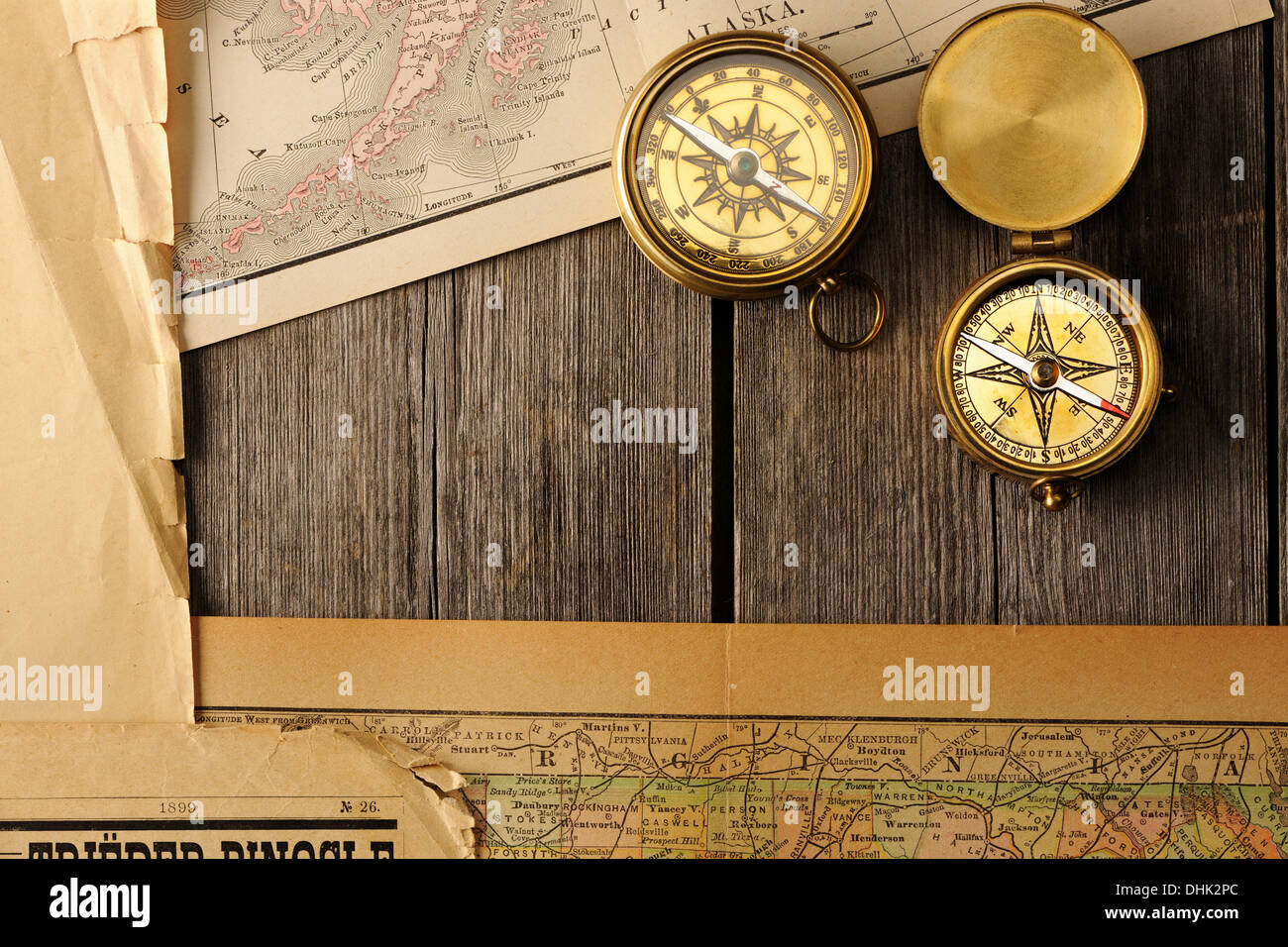 Antique compasses over old map Stock Photo