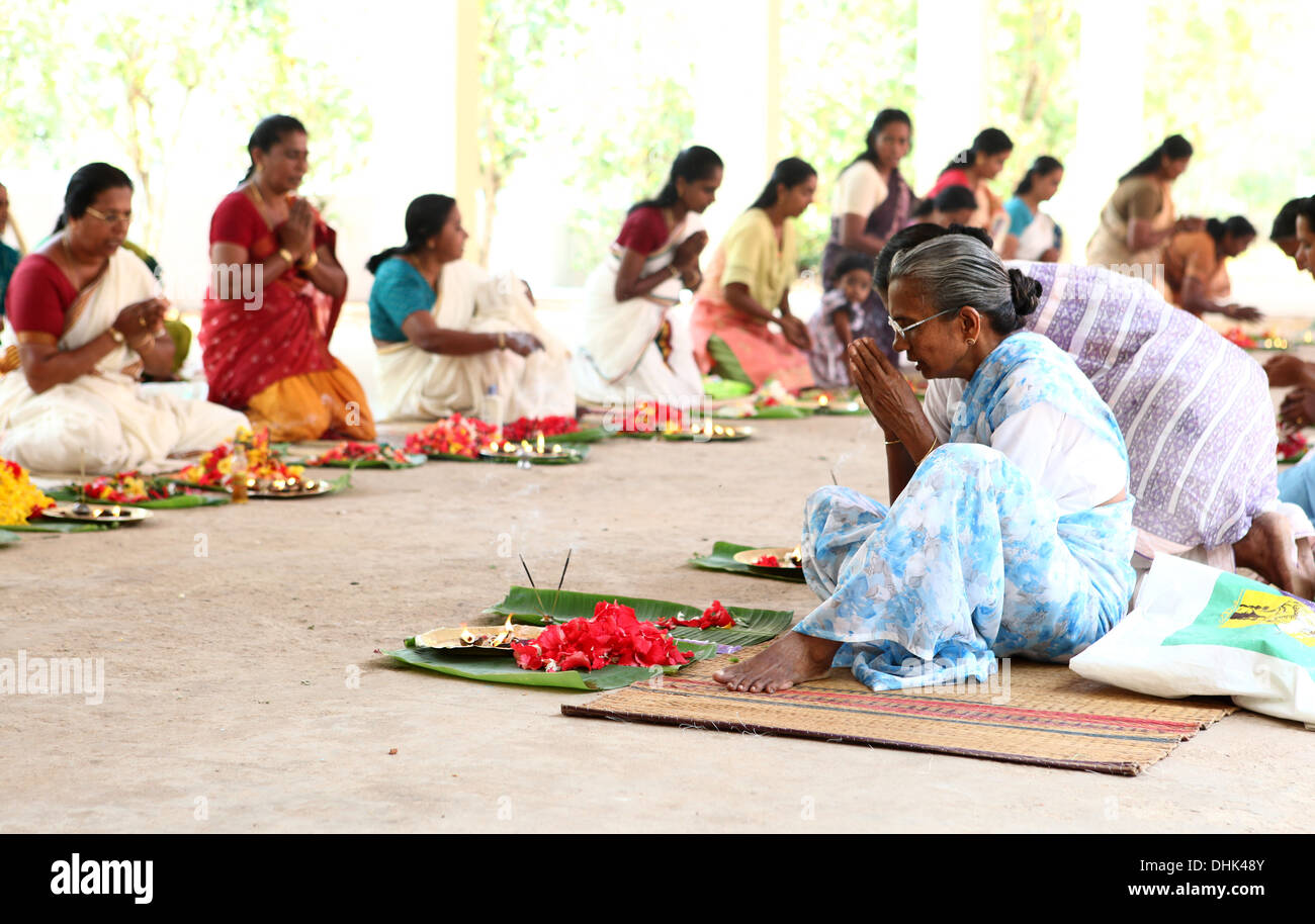 Group of women with offerings praying in a Hindu temple in Varkala,India, Stock Photo