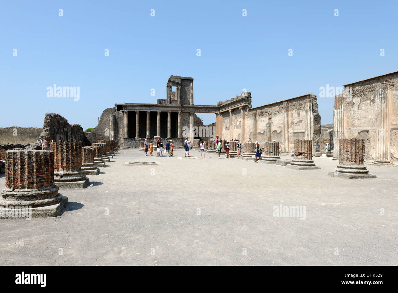 Part view of the Basilica with the elegant Hellenistic styled two-level Tribunal in the background at Pompeii Italy. Dating back Stock Photo