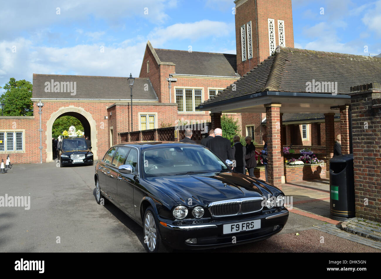 A  cremation is the preferred method of burial nowadays.The cars wait outside  the crematorium. Stock Photo