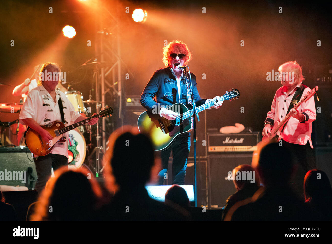 Birmingham, UK . 11th Nov, 2013. Reformed 1970s rock band Mott the Hoople play the first concert of their UK tour at Birmingham Symphony Hall, 11 October 2013. Lead singer Ian Hunter with dark glasses. Mick Ralphs on guitar and Overend Watts on bass. © John Bentley/Alamy Live News Stock Photo