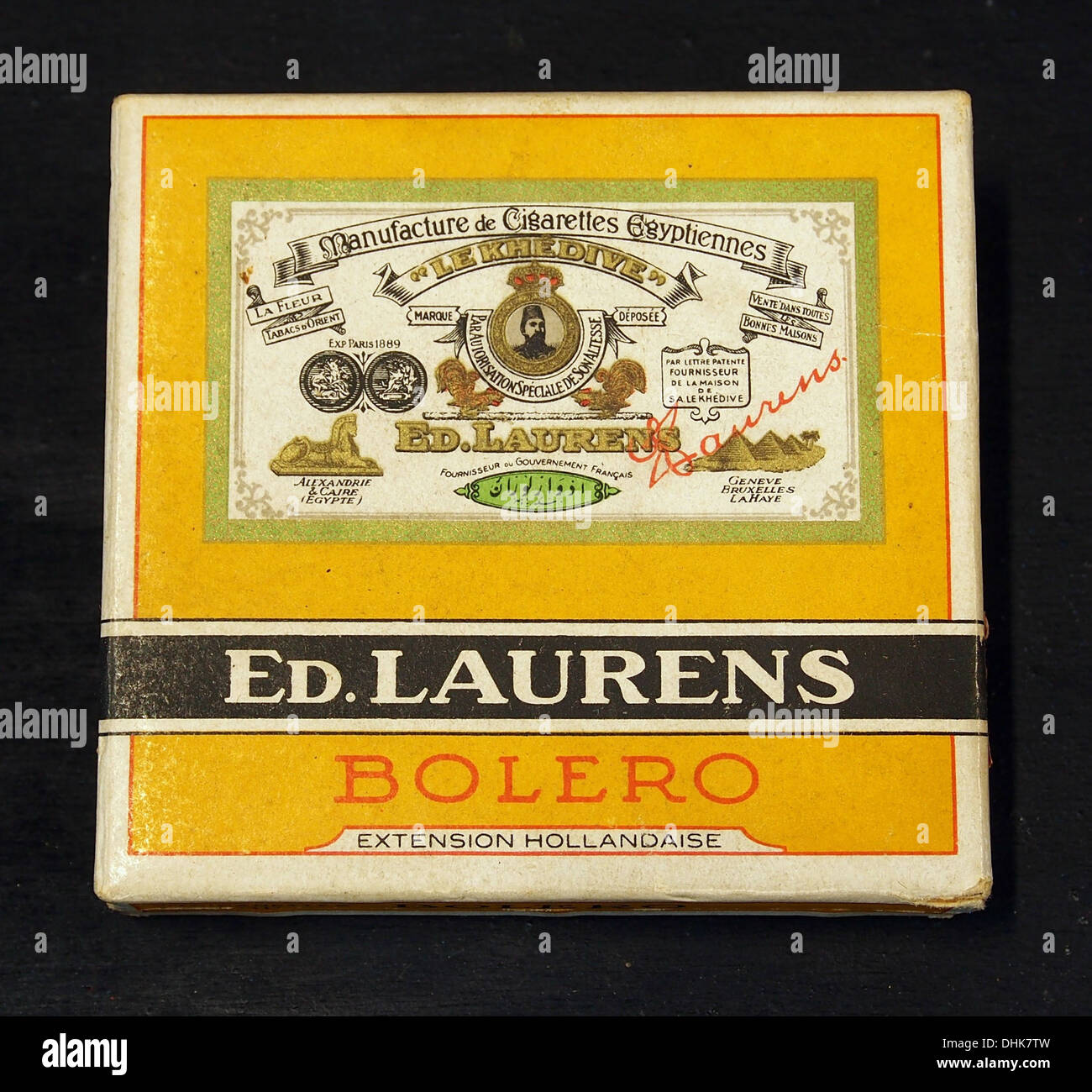 Ed Laurens Bolero cigarettes are presented in their classic packaging. The  cigarette pack is an iconic representation of mid-20th century tobacco  products and packaging design, reflecting the smoking culture of that era