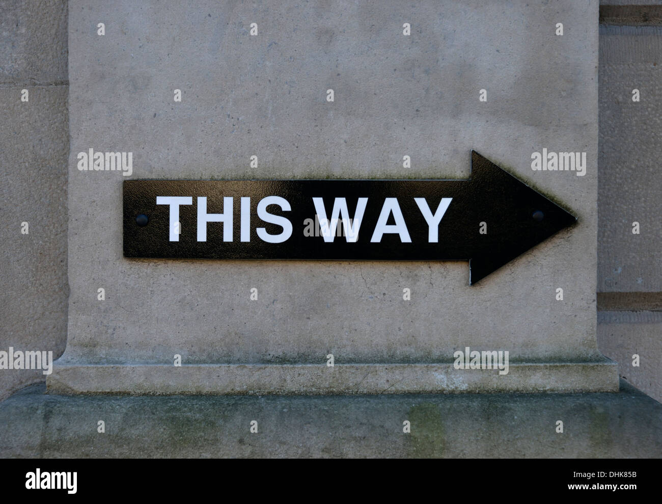 'THIS WAY', black arrow pointing to right. Sandes Avenue, Kendal, Cumbria, England, United Kingdom, Europe. Stock Photo