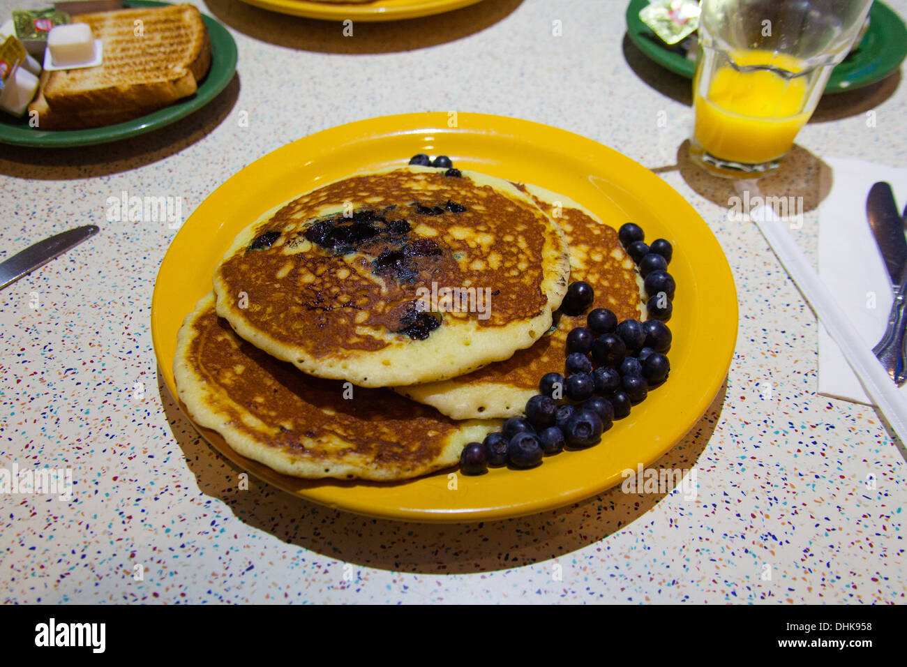 Blueberry breakfast pancake's, Tick tock diner at the New Yorker Hotel, Eighth Avenue, Manhattan, New York City, United States o Stock Photo
