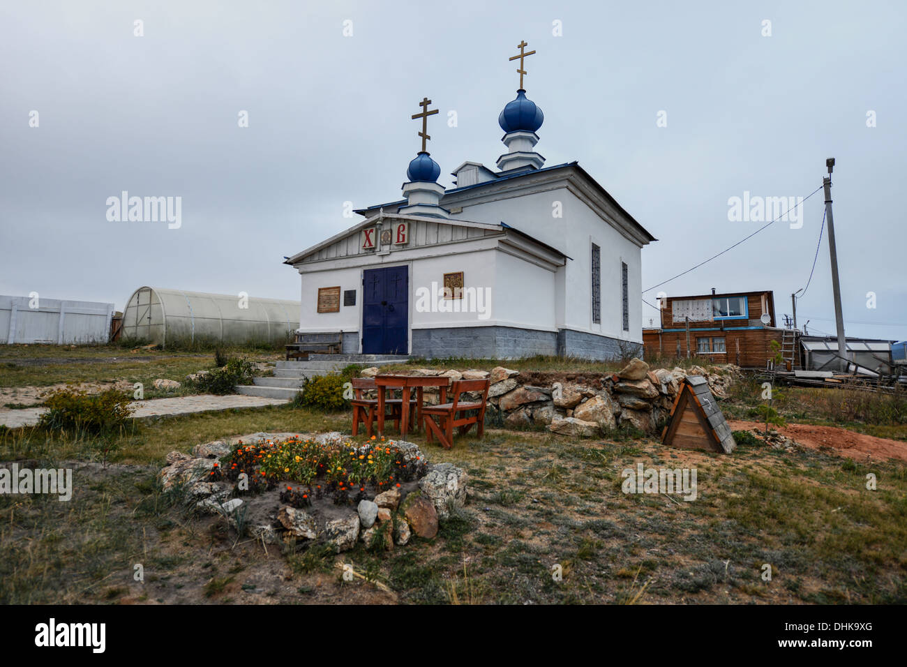 Small Russian Orthodox Church, Khuzir, Olkhon, Russia. White Orthodox Christian Church with blue onion domes. Stock Photo