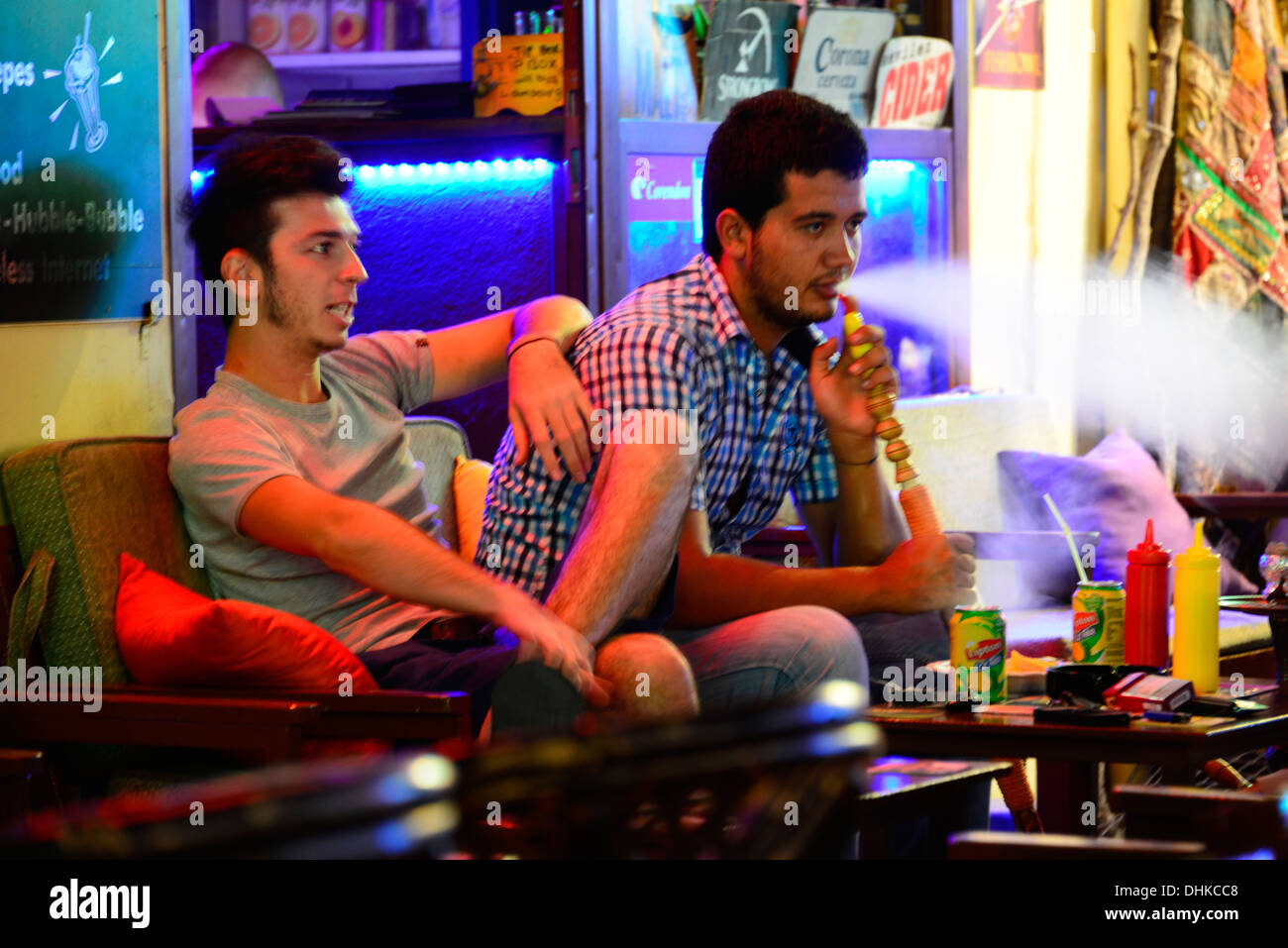 Young men at Shisha bar. Stock Photo
