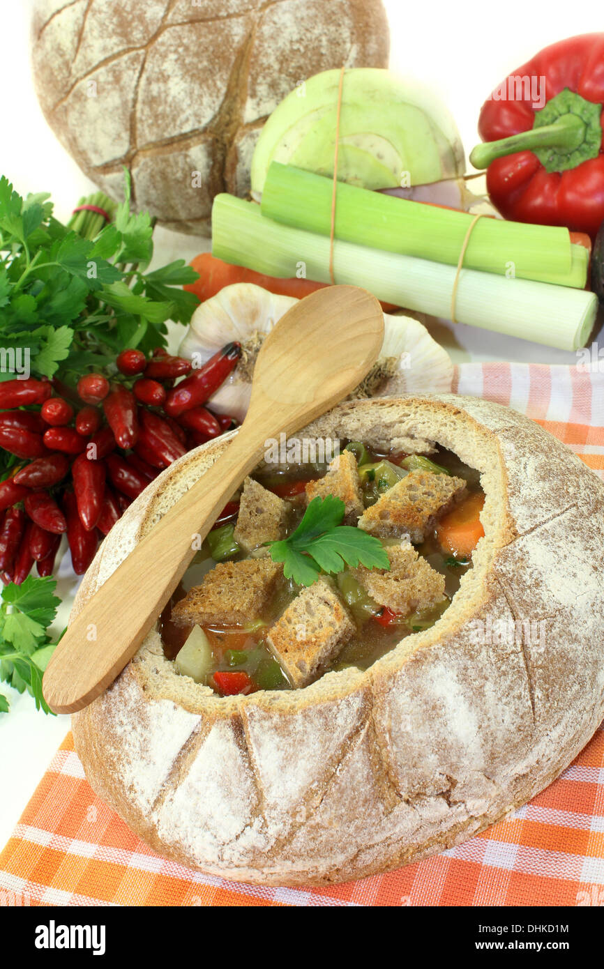a farmhouse bread stuffed with a colorful bread soup Stock Photo