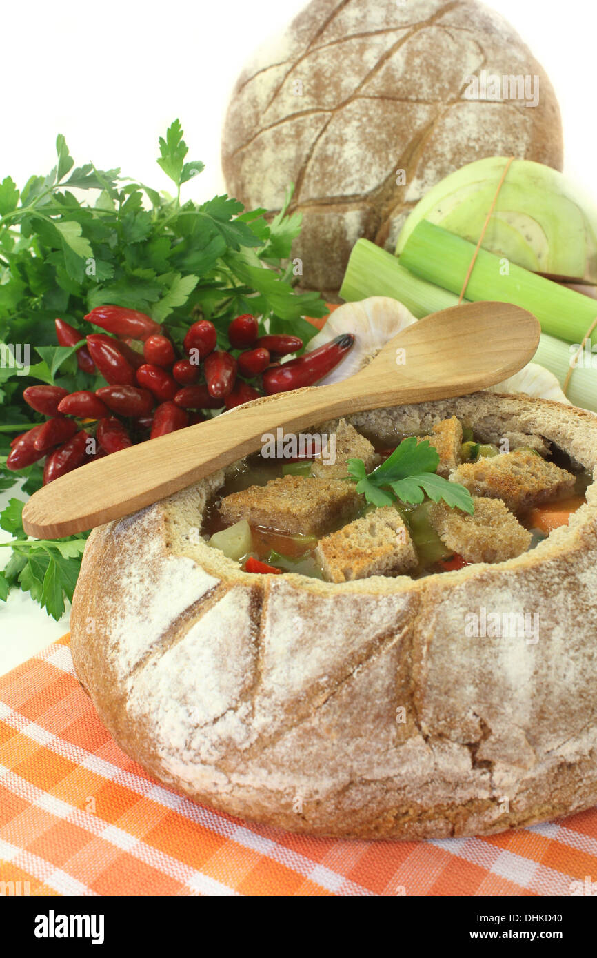 a farmhouse bread stuffed with a colorful bread soup Stock Photo