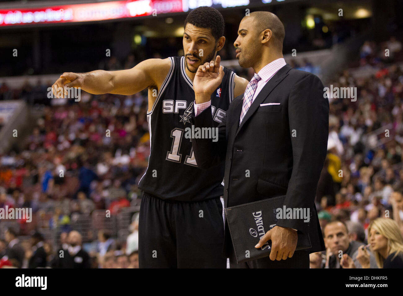 November 11, 2013: San Antonio Spurs power forward Jeff Ayres (11) points things out to assistant coach Ime Udoka during the NBA game between the San Antonio Spurs and the Philadelphia 76ers at the Wells Fargo Center in Philadelphia, Pennsylvania. The Spurs win 109-85. (Christopher Szagola/Cal Sport Media) Stock Photo