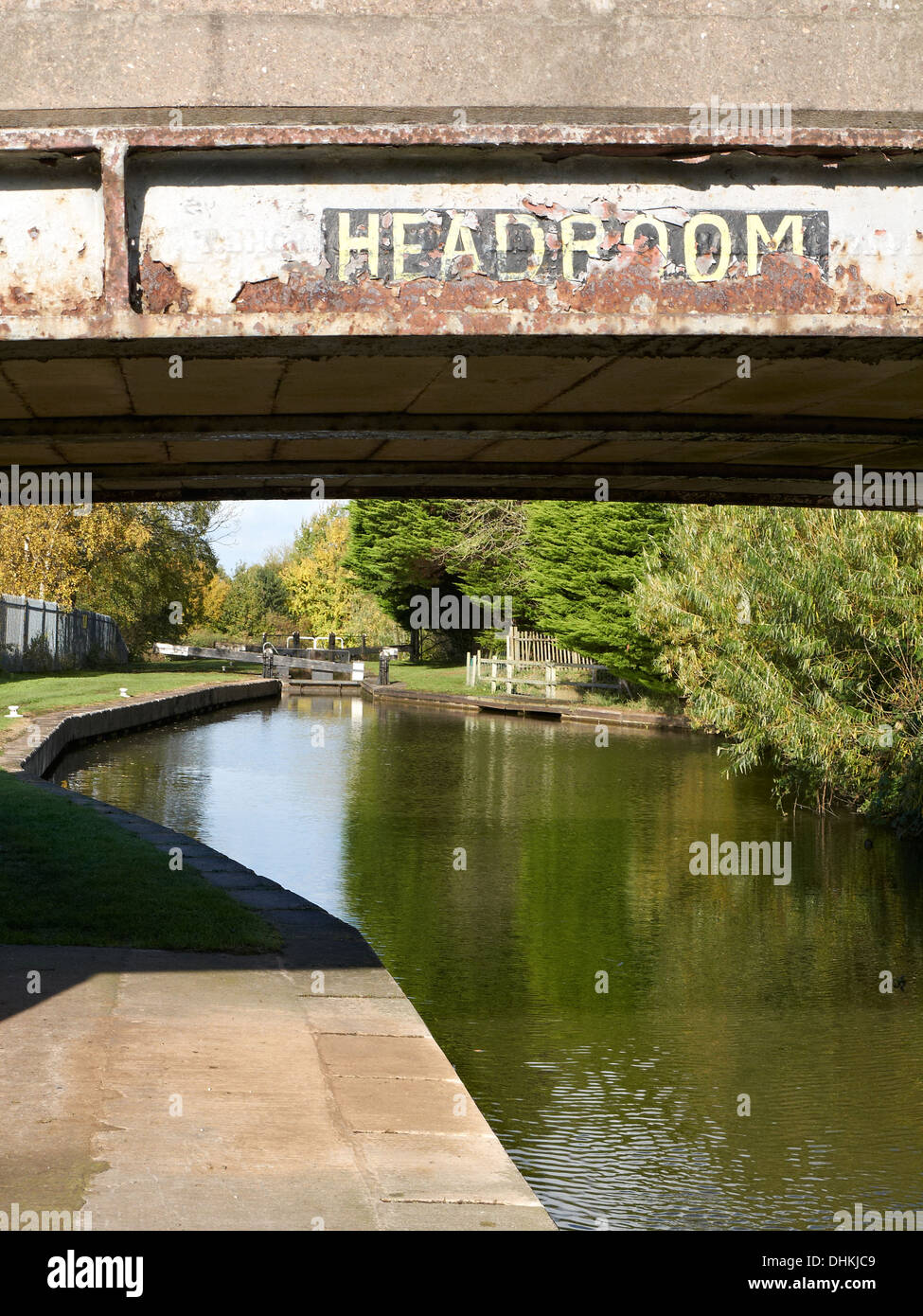 Headroom sign bridge 161 on the Trent & Mersey Canal also known as Crowns Nest Bridge with Crowns lock in distance, Sandbach UK Stock Photo