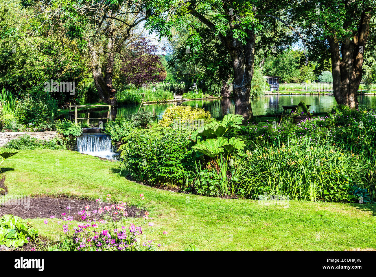 The pretty landscaped garden of the Trout Farm in the Cotswold village