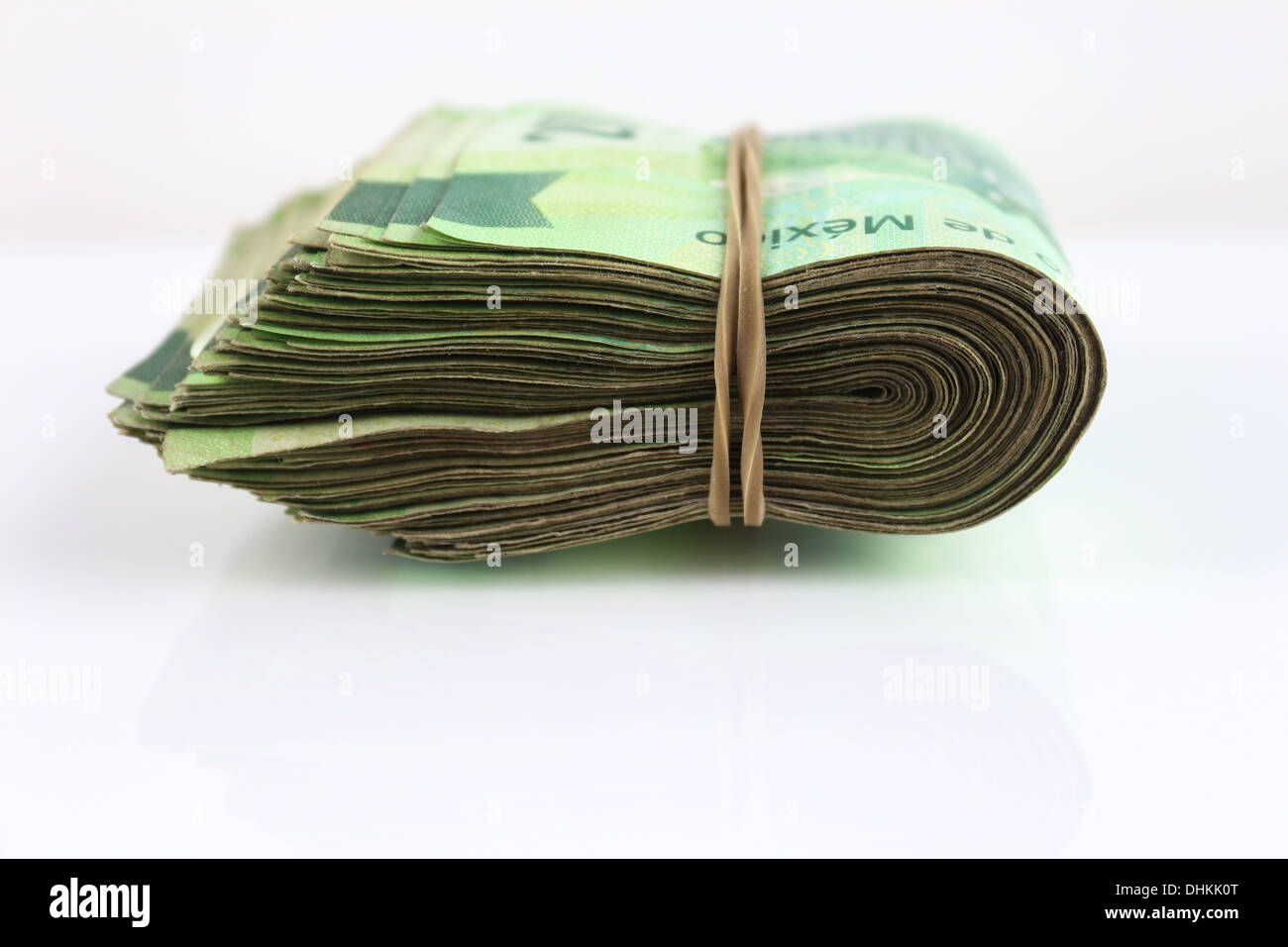 Big stack of Cash. Isolated on white background Stock Photo