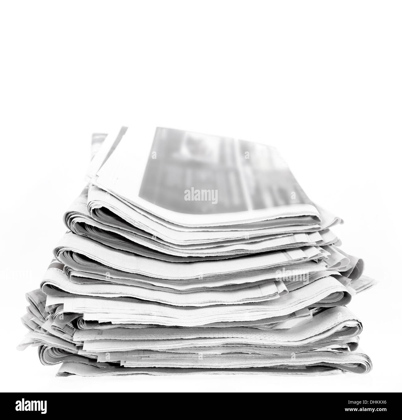 Closeup of newspapers on plain background Stock Photo