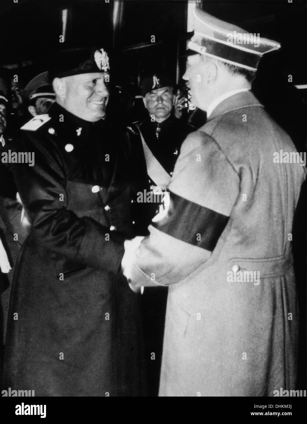 Adolf Hitler and Benito Mussolini Greeting Each Other and Shaking Hands, 1938 Stock Photo