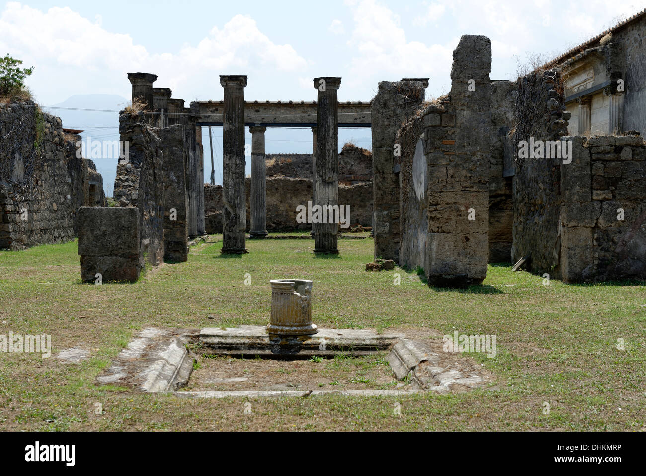 View across the atrium with Impluvium to the tablinum and Peristyle of the House of the Figured Capitals, Pompeii Italy. Stock Photo