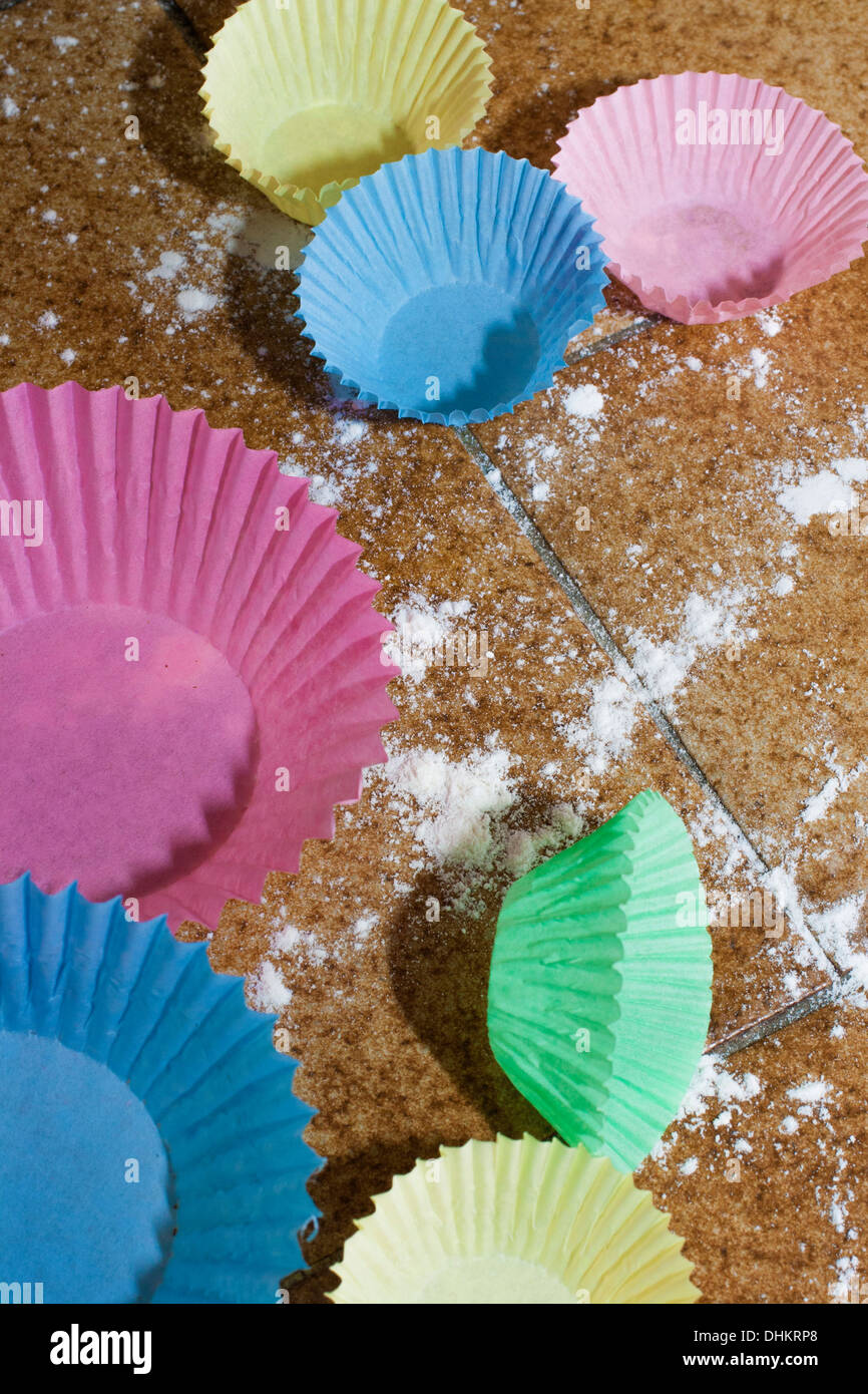 Baking, Cupcakes, Bun cases, Flour,  Table top, Messy, Colourful, Bright, Close up photography. Stock Photo