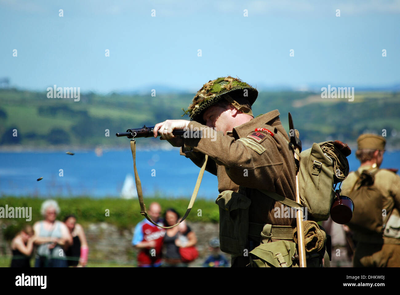 bullets emerging from gun, fired by a world war two british soldier at re-enactment event Stock Photo