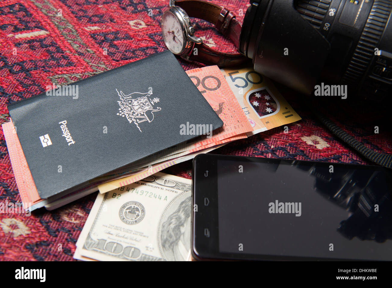 Essentials for travel brought together - passport, money, camera, mobile phone, watch. Stock Photo
