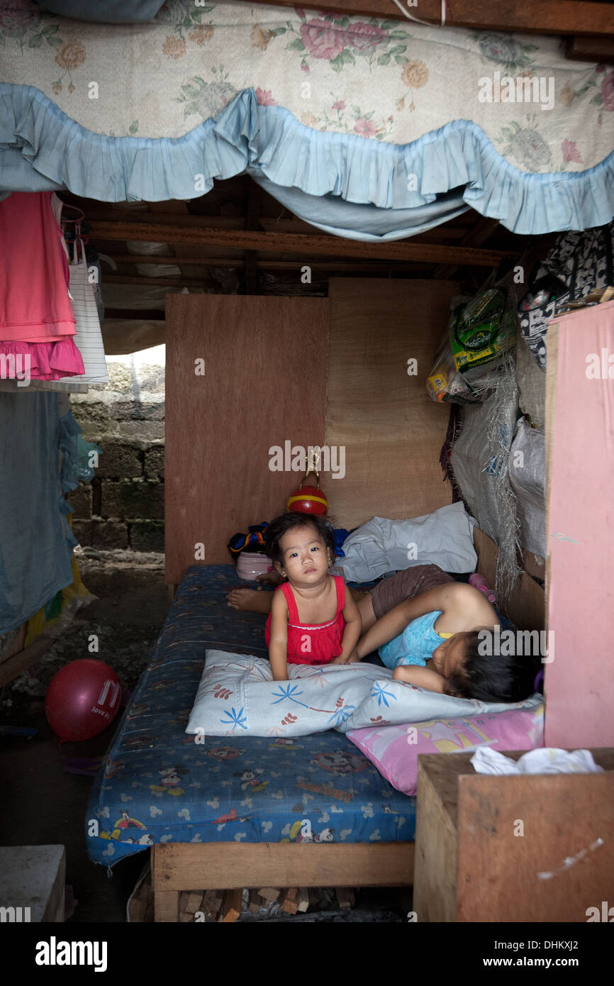 Temporary Baby Roodyi A mother and child in their temporary home at the side of the road in ...