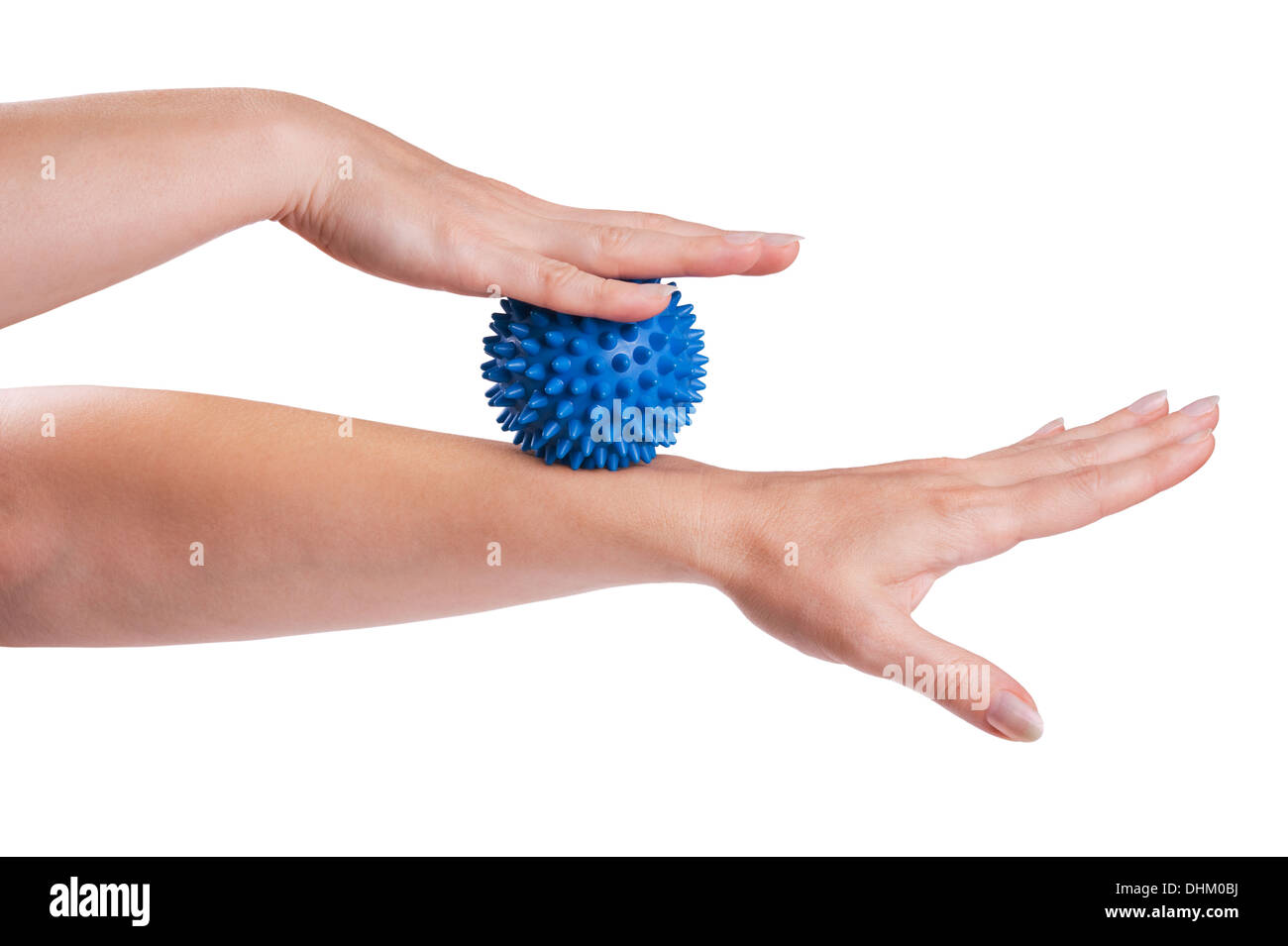Womans hand with Spiny plastic blue massage ball isolated on white Stock Photo