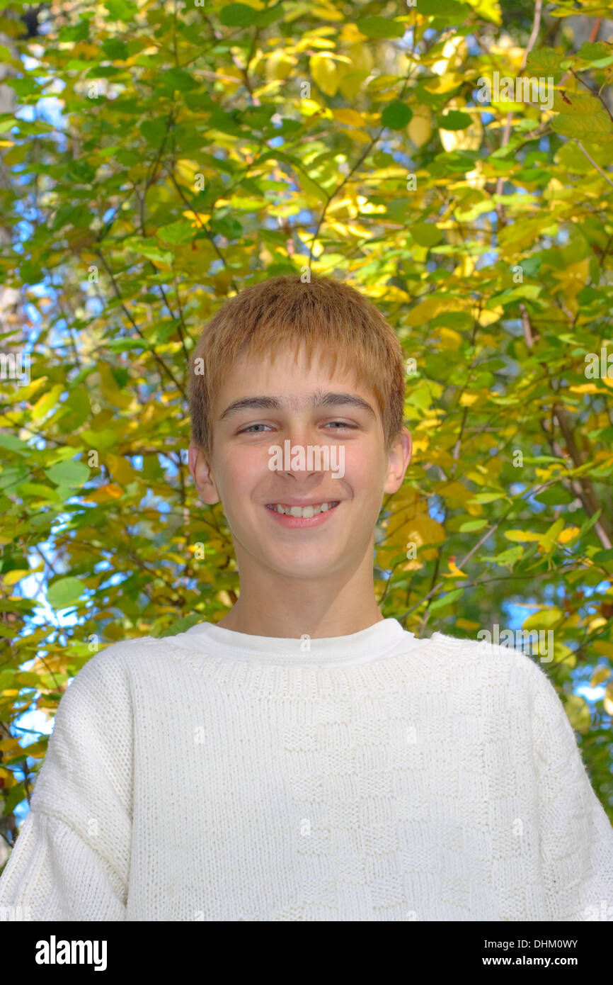 boy in autumn forest Stock Photo