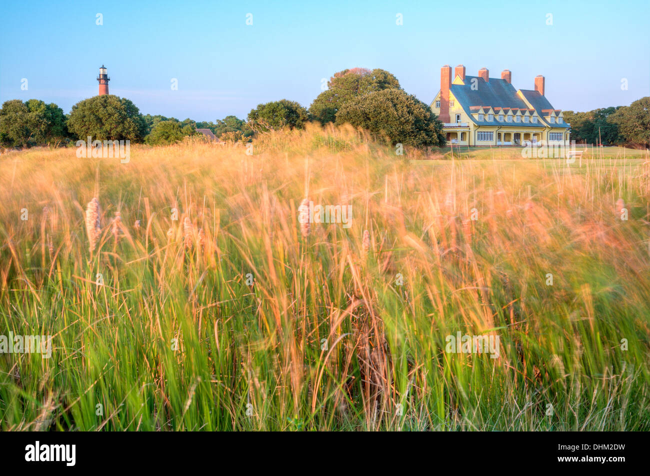 Currituck Beach Lighthouse and the Whalehead Club with the setting sun