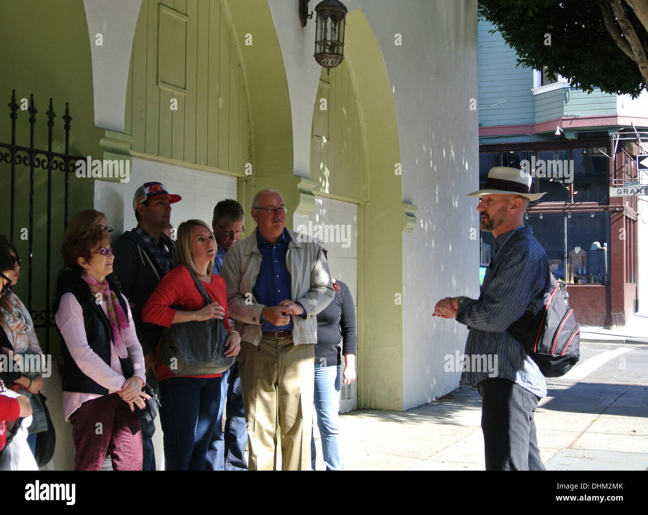walking tour guide lectures on history of North Beach on Grant Street