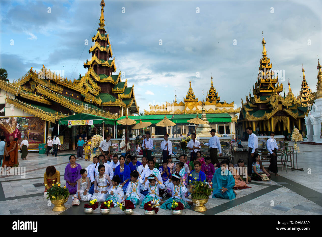 Evening prayers at the grounds of the Shwedagon Pagoda, in Yangon. Stock Photo