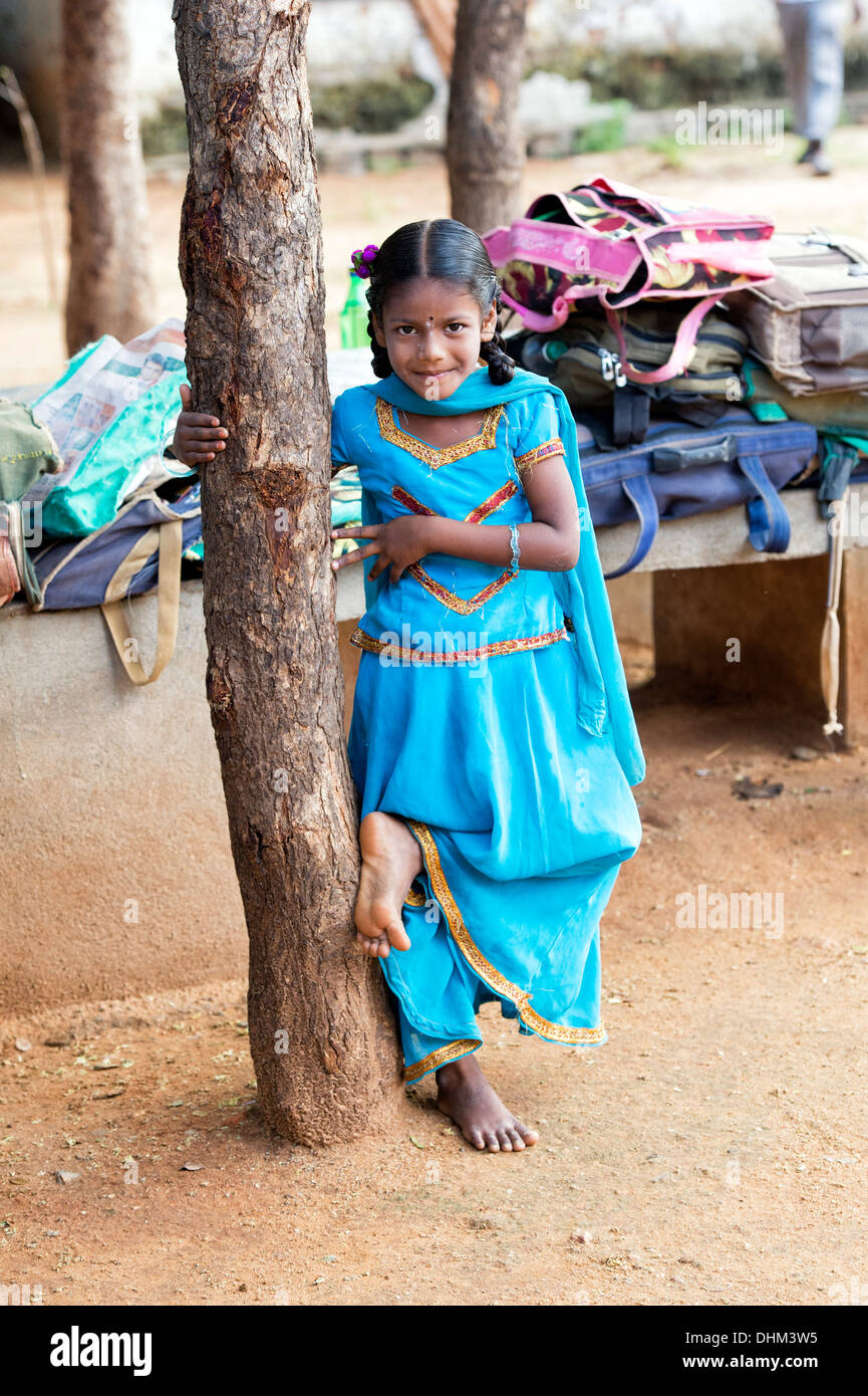 Rural Indian village school girl standing by a tree in an outside class. Andhra Pradesh, India Stock Photo