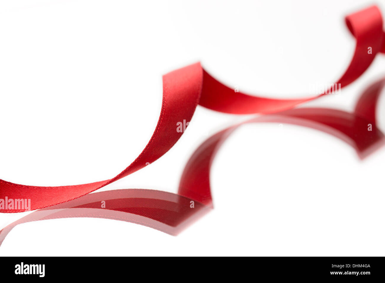Beautiful fabric red ribbon on white background Stock Photo - Alamy