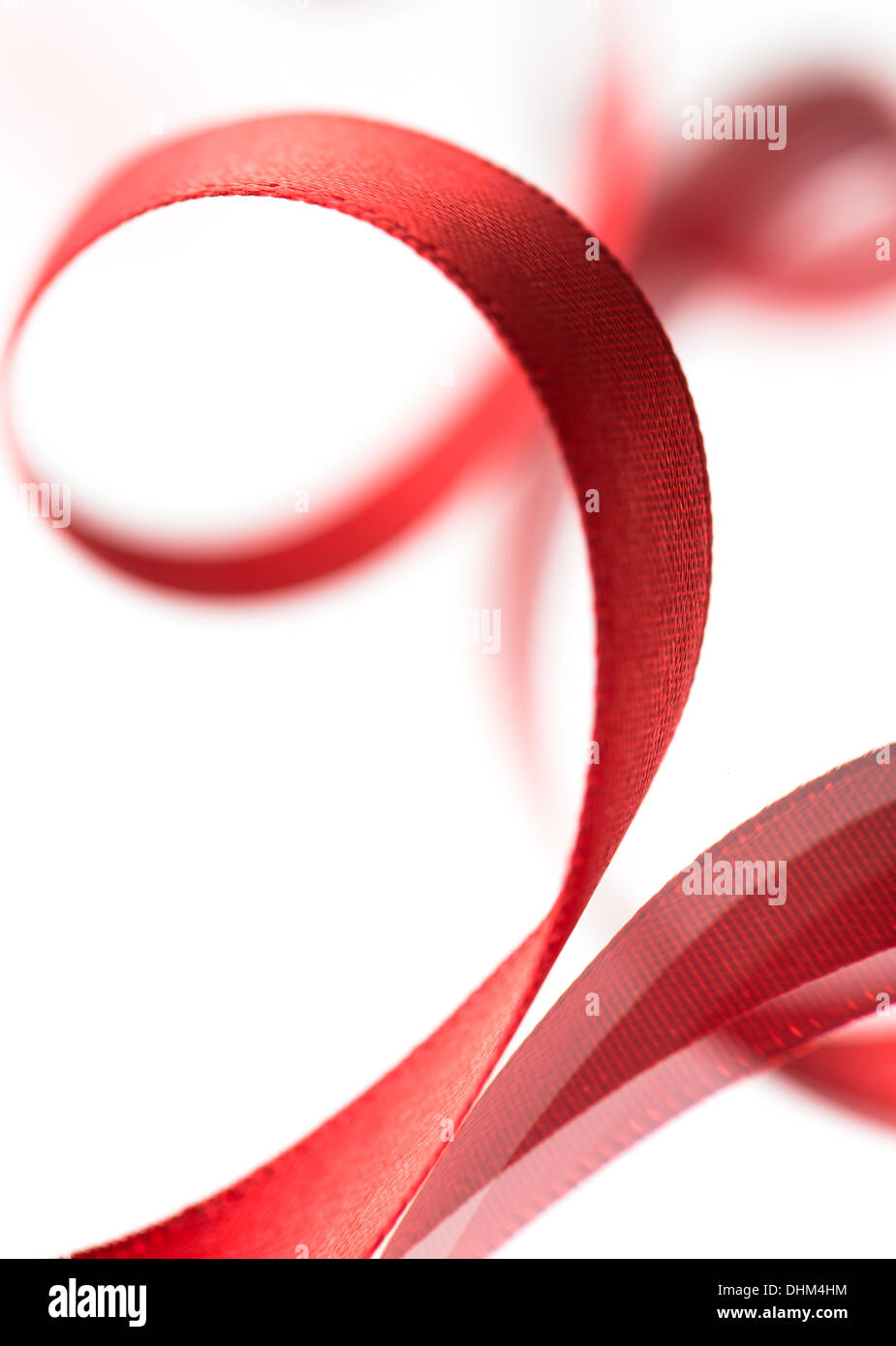 Beautiful fabric red ribbon on white background Stock Photo - Alamy