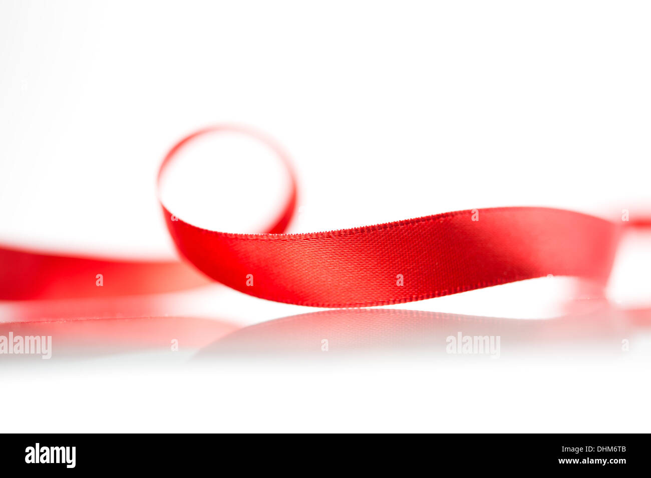 Beautiful fabric red ribbon on white background Stock Photo - Alamy