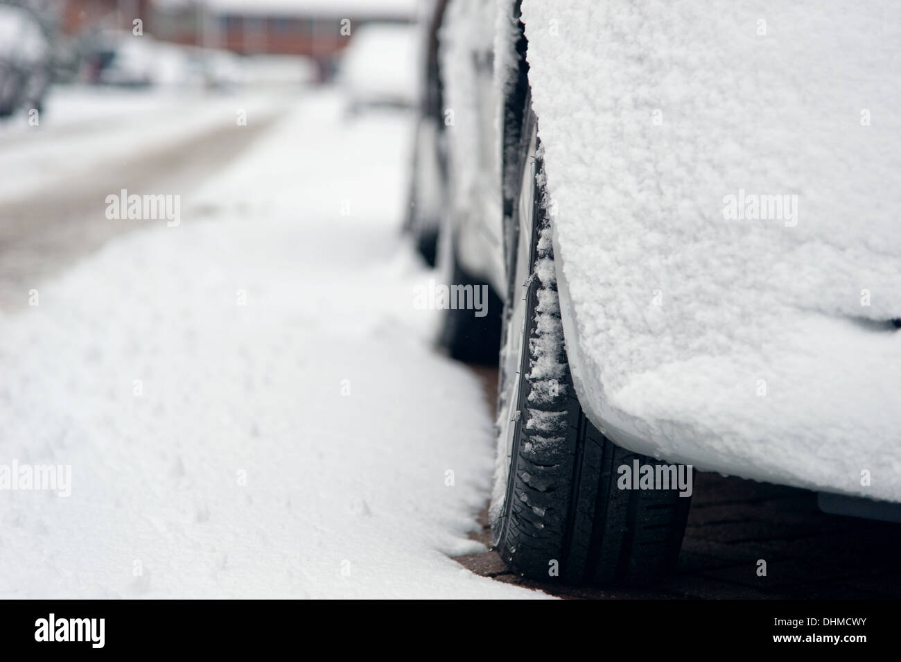Car in the winter covered with snow and parked on the street Stock ...