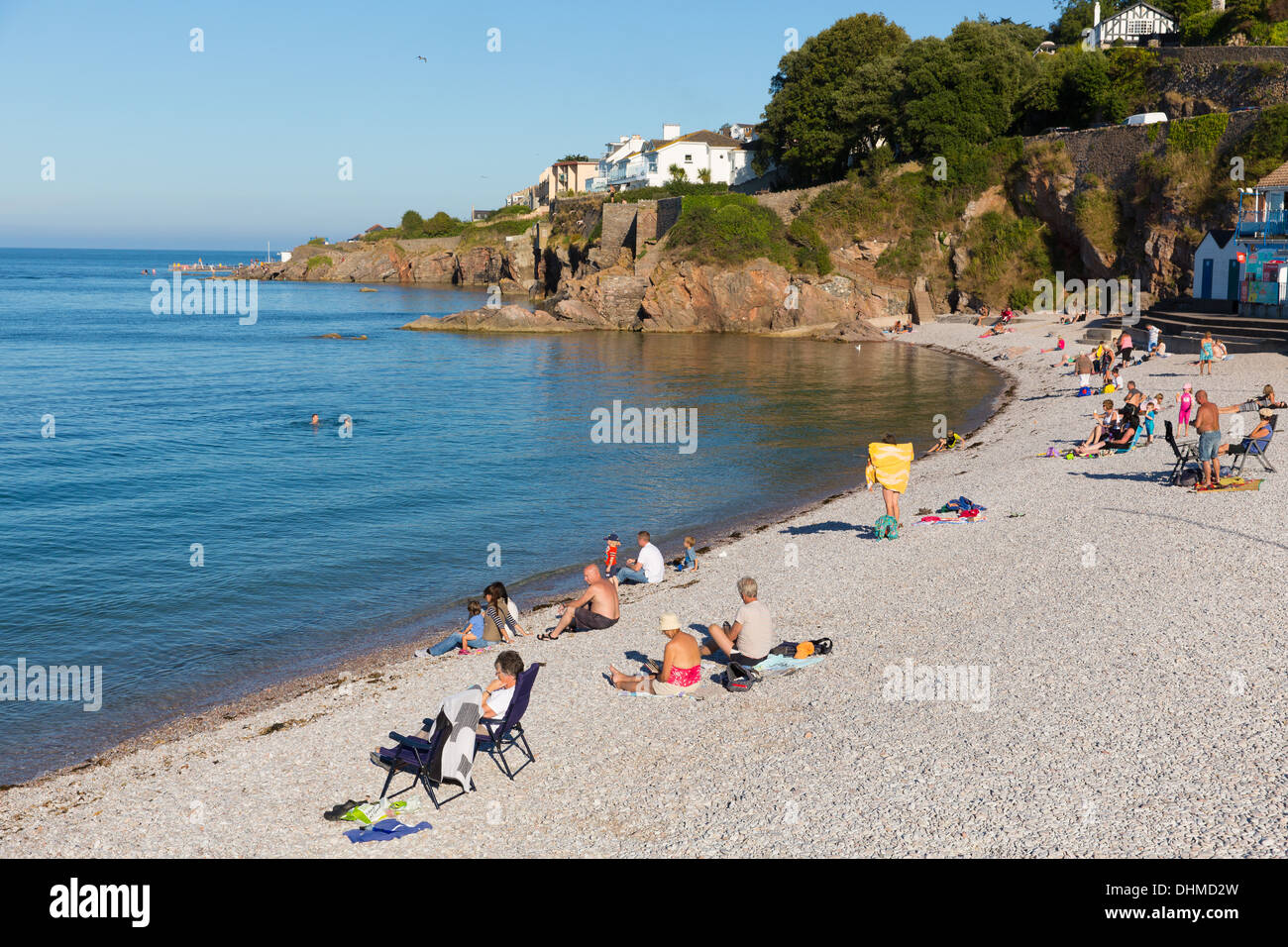 Tourists on Brixham breakwater beach Devon England UK in summer with