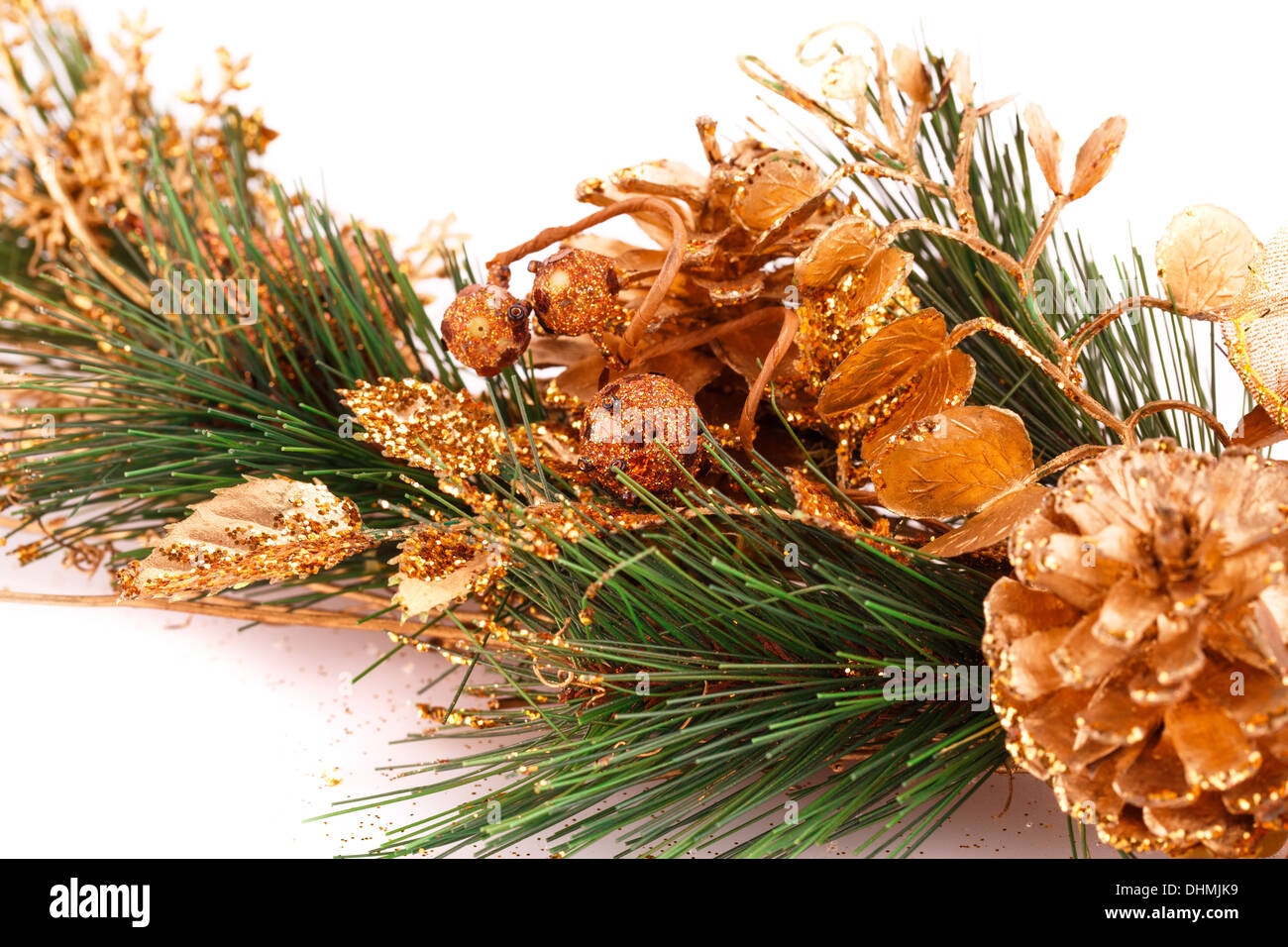 Christmas tree branch with cones on white background Stock Photo - Alamy